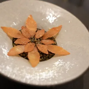 a plate of food with a flower on it