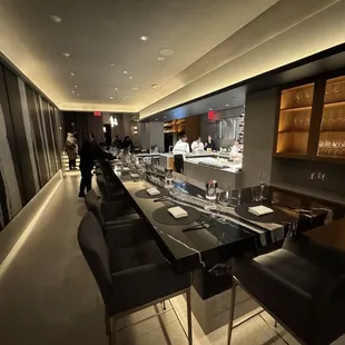 a long dining table with chairs