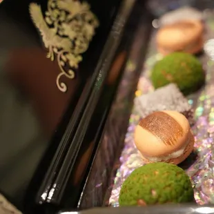 a close up of a tray of desserts