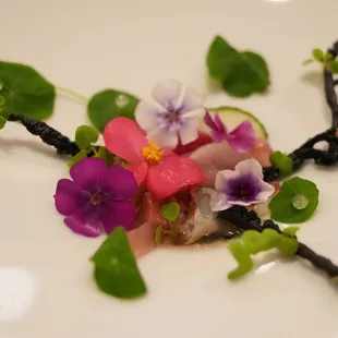 a plate of food with flowers on it