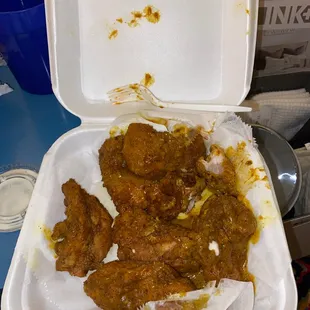 chicken wings in a styrofoam container