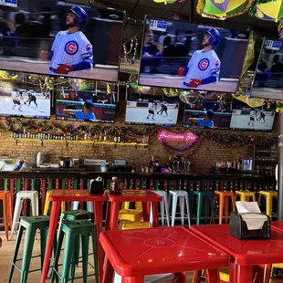 a view of the bar and televisions