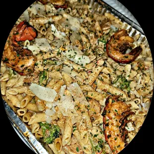 Million Dollar Pasta: Snowcrab,  Shrimp, Crawfish, tossed in a Cajun Alfredo Sauce and topped with Lobster Tails.