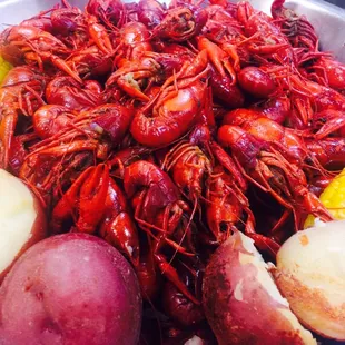 a bowl of cajuns, potatoes, and corn