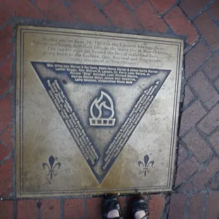 Memorial plaque outside the Jimani Lounge commemorating the Upstairs Lounge fire of 1973 in which thirty people died.