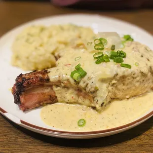 Pork Chop &amp; Gouda grits topped with their &quot;Lafitte sauce&quot;  AKA crawfish cream sauce. Amazeballs :)...