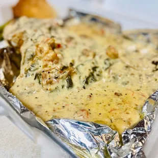 The redfish covered in the crawfish sauce is amazing get it! :)...