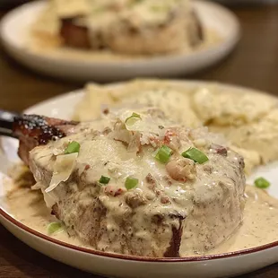 2 Pork Chop entrees with Lafitte sauce &amp; cheese grits. Lafitte sauce is a crawfish &amp; shrimp cream sauce. Superb :)...