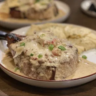 2 Pork Chops with cheesy grits. Yes we drive 7 hours to eat this as often as possible :)...