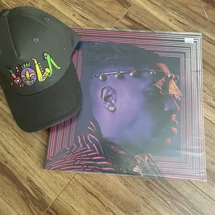 NOLA baseball cap by local artist and Axiom live double album by Christian Scott Atunde Adjuah