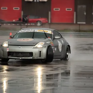 A car drifting on the Skid Pad at NOLA Motorsports park during a local drift event.