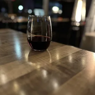 a glass of wine on a table