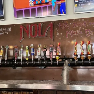 a row of beer taps