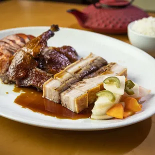 a plate of meat and vegetables