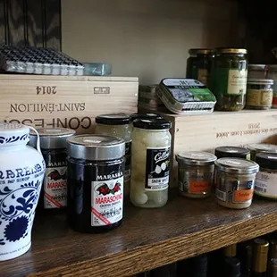 Cocktail garnishes, canned seafood, and assorted charcuterie accoutrements