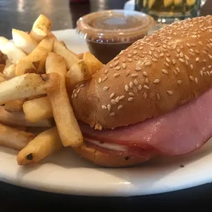 a sandwich and french fries on a plate