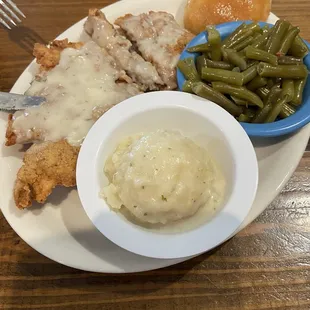 Chicken fried steak with mashed potatoes and green beans