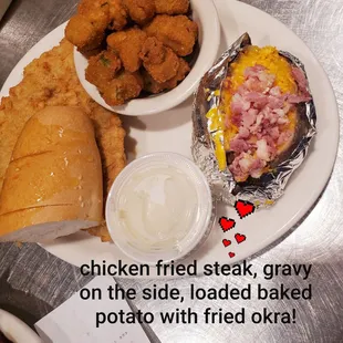 chicken fried steak, gravy on the side, loaded baked potato with fried okra