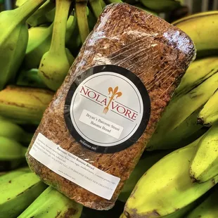 a loaf of bread and a bunch of bananas