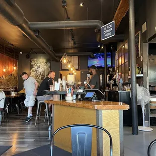 customers sitting at the bar