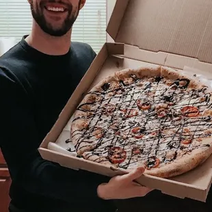My incredible husband and his favorite Caprese Pizza