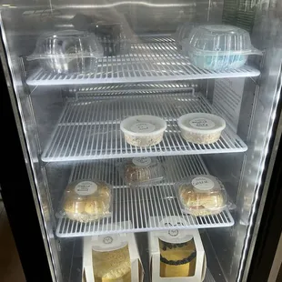 Dark chocolate cake by the slice, petit fours, chicken salad, chicken salad sandwiches, and $20 grab and go cakes