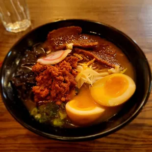 a bowl of ramen with a boiled egg