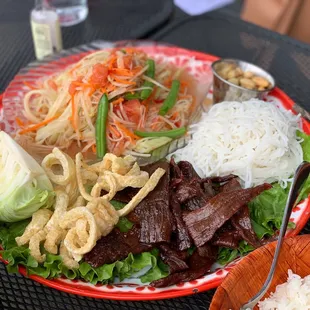 Papaya salad, beef jerky platter (Laos style)