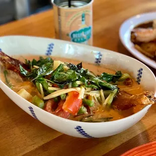 Crispy Duck Curry ($23) in Red Curry with Pineapple, Peppers, Tomatoes, Onions, and Green Beans