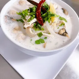 a bowl of soup on a plate