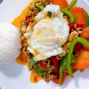 Stir-fried minced chicken or pork in spicy-brown sauce, served with steamed rice and fried egg. Spicy.
