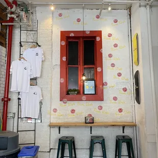a table and chairs in front of a window