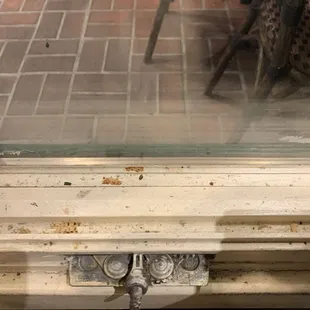 Dirty window seal with old food crumbs