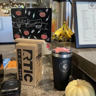 a cup of coffee and a pumpkin