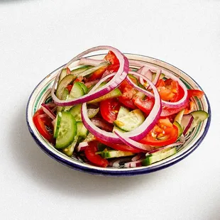 a bowl of salad on a table