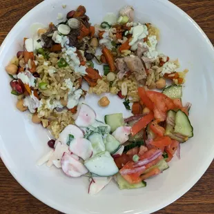Here's my plate with beef and chicken plov, tomato and cucumber salad, and radish and cucumber salad in yogurt.