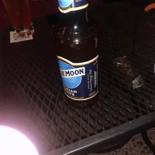 a bottle of moon beer on a table