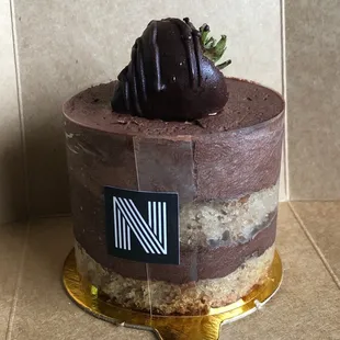 a chocolate cake with a strawberry on top