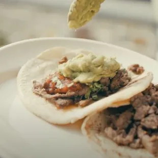 a plate of tacos on a table