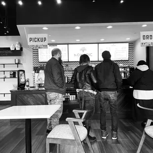 a black and white photo of diners