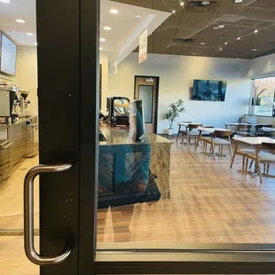 a view of the dining area through the glass door