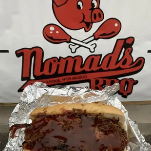 a hot dog with barbecue sauce
