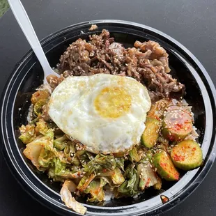 Bulgogi bowl with steamed rice and kimchi cucumbers!