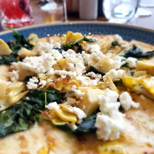 Spinach and Artichoke Flatbread: feta cheese, garlic cream, citrus zest