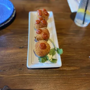 a plate of appetizers on a table