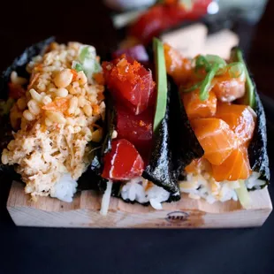 (Left to Right) Lump Crab Hand Roll, Tuna Poke Hand Roll, Ponzu Salmon Hand Roll