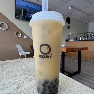 Jasmine milk tea with boba, 50% sugar, regular ice, and almond milk