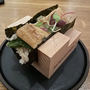 a sushi sandwich on a plate