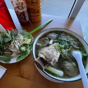 a bowl of soup and a plate of salad