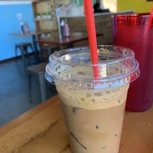 a cold beverage in a plastic cup